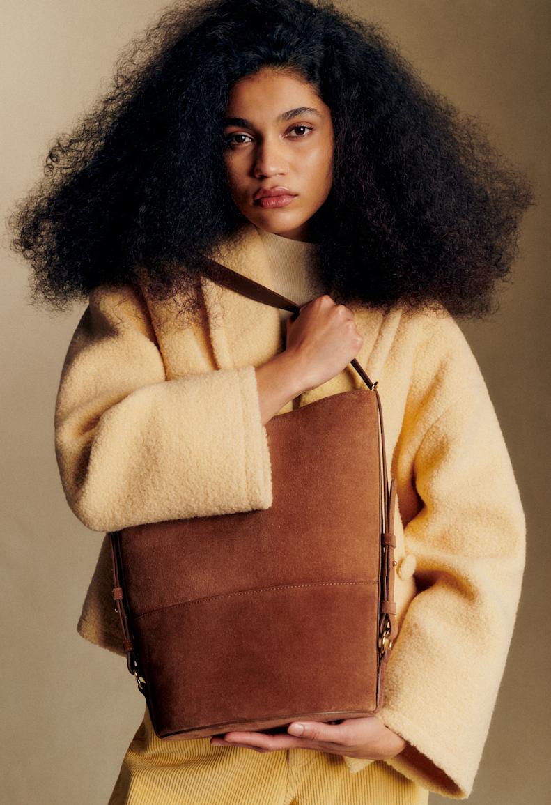 Sézane Essentials - Woman in yellow coat